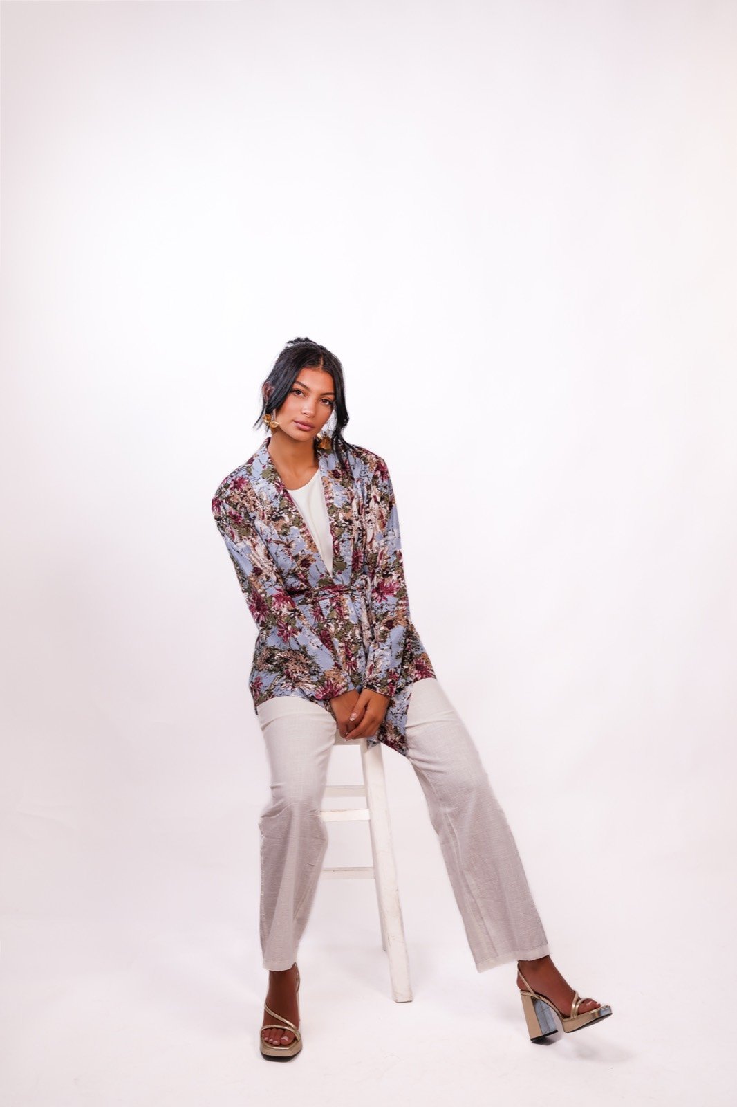 Bluebell blazer in a muted floral print, turned, showing the shoulder, from the Le Kanz summer collection